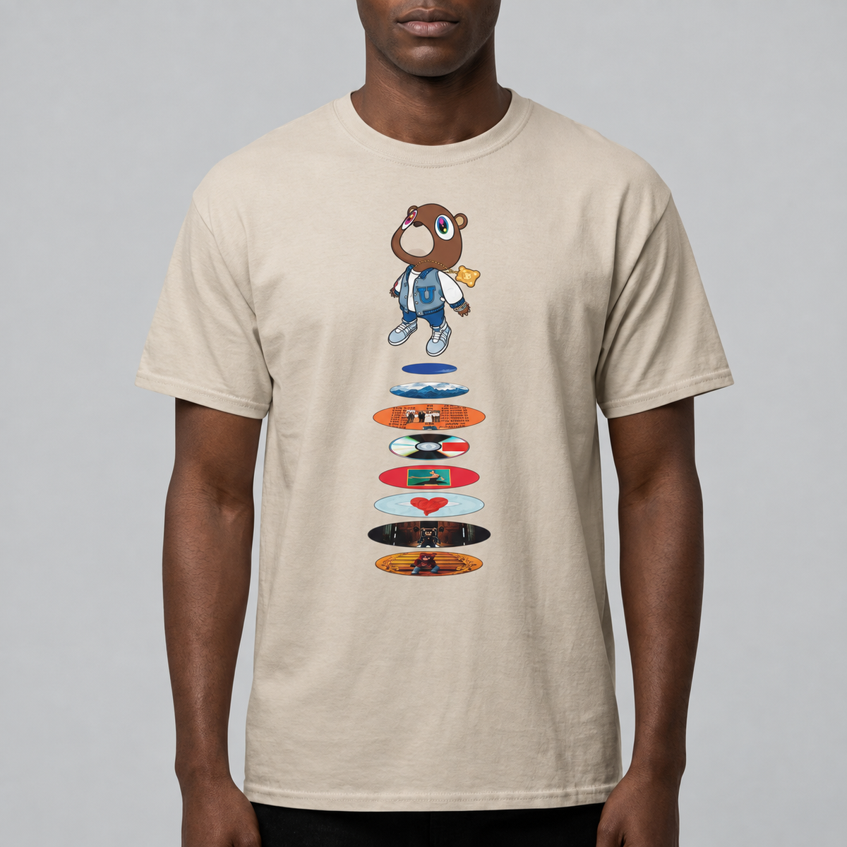 Graduation Bear Discography Tee, Gildan 5000, printed front worn by a dark-skinned model, original regular cut sized up, Gelato model photo with corrected artwork