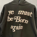 Raised cream lettering on Ye Must Be Born Again hoodie