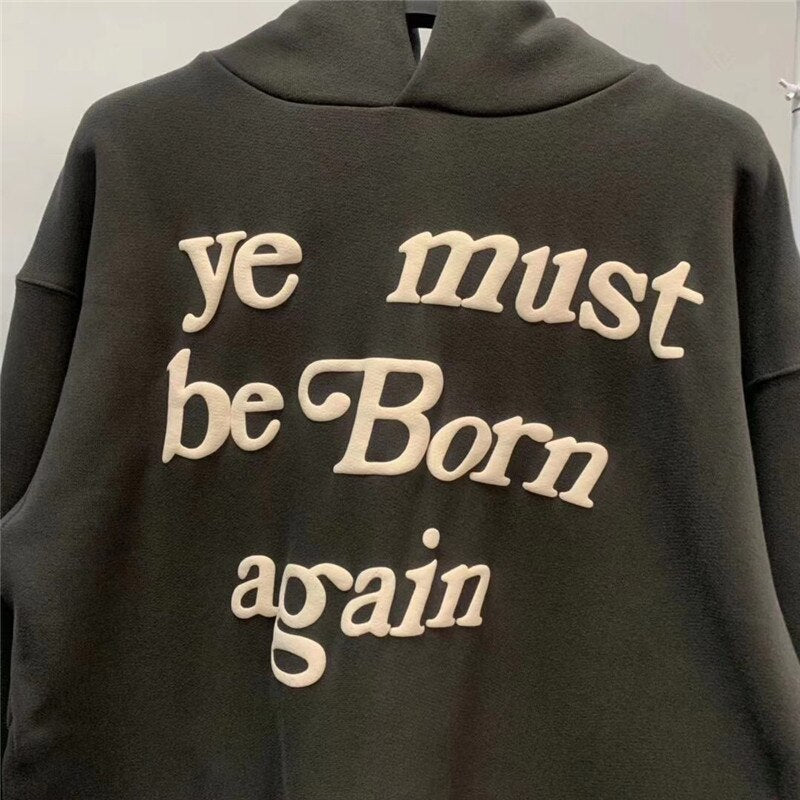Raised cream lettering on Ye Must Be Born Again hoodie
