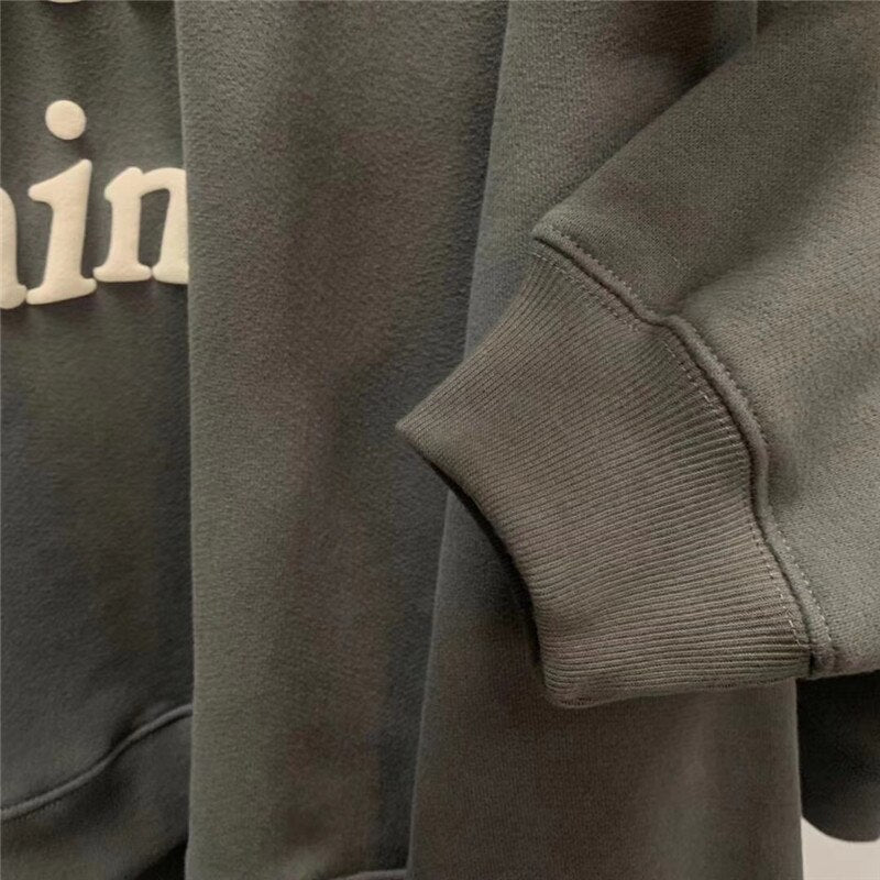Charcoal hoodie fabric, cuff and seam detail